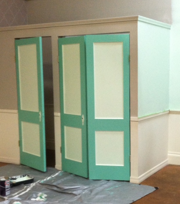 The work in process of painting the doors and fitting room area!